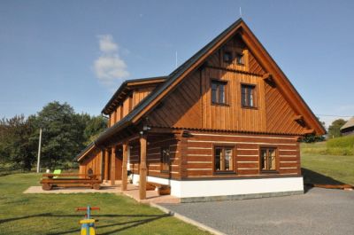 Timber cottage under Kozákov