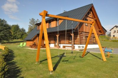 Timber cottage under Kozákov