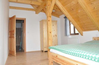 Timber cottage under Kozákov