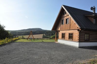 Timber cottage under Kozákov